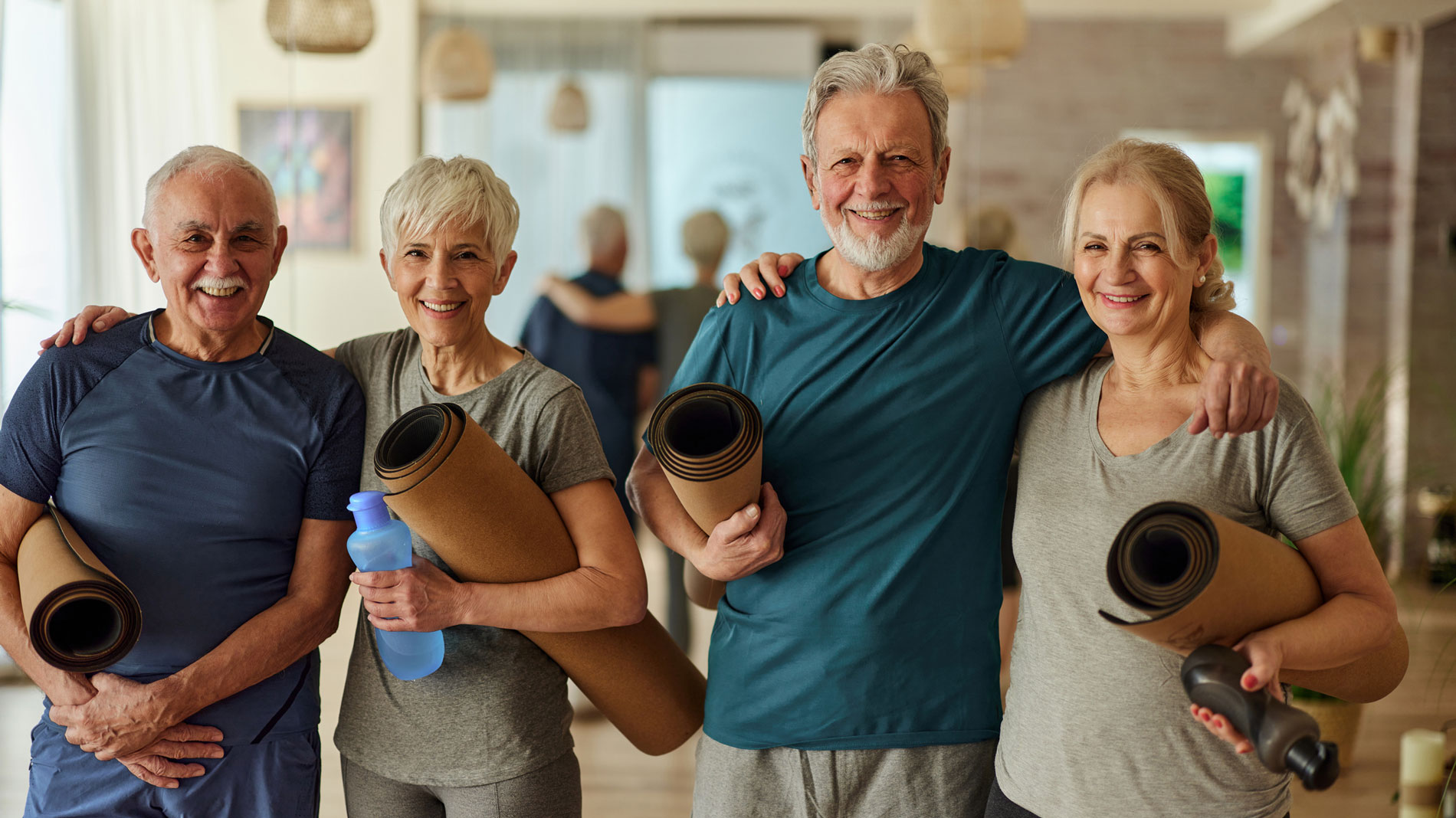 Happy senior couples ready for exercise class